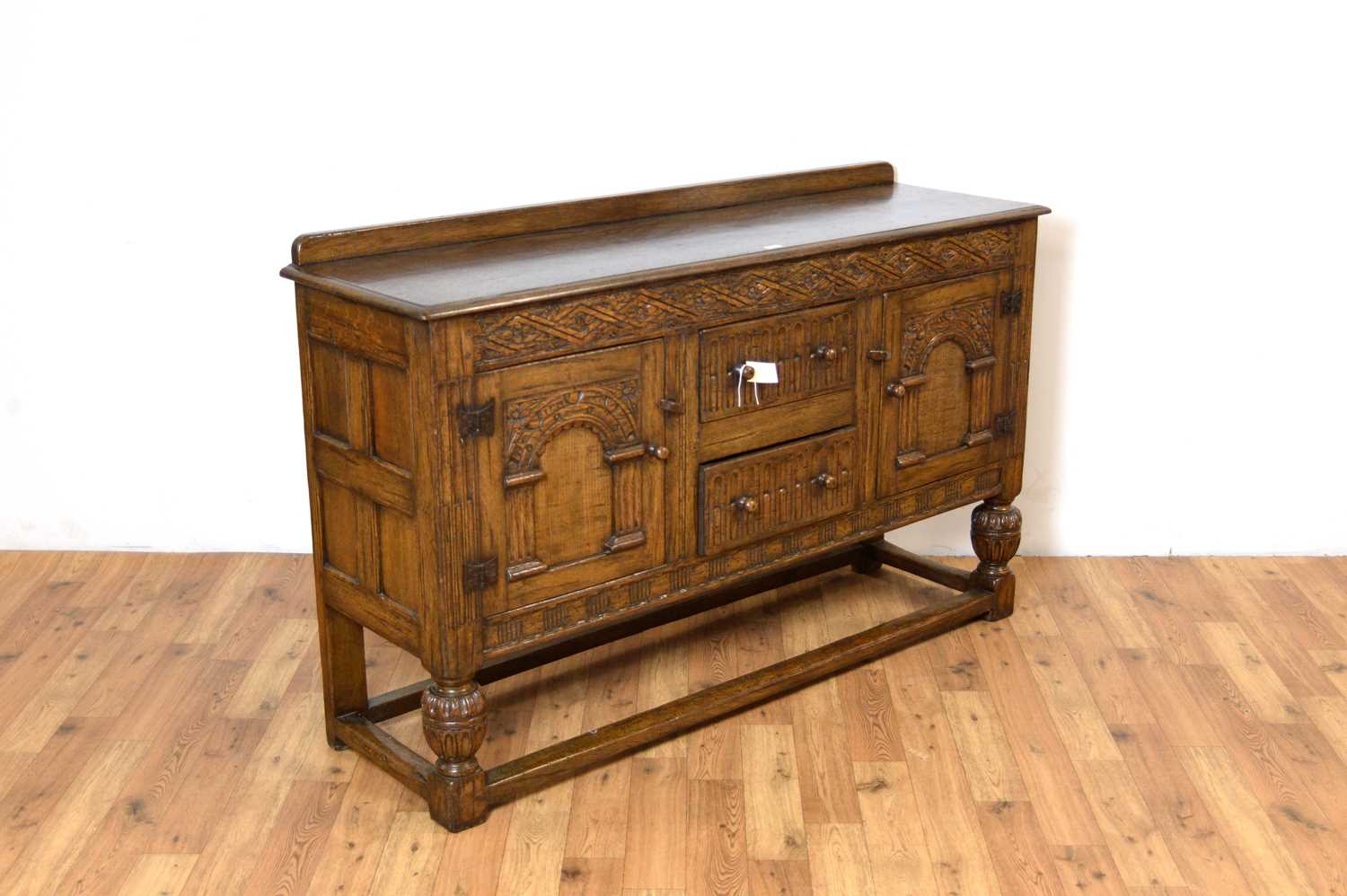 Siesta by N.H Chapman of Newcastle upon Tyne: A Jacobean Revival oak sideboard - Image 3 of 5