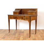 A late Victorian mahogany and line inlaid serpentine writing desk