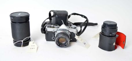 An Olympus OM-1 camera and lenses