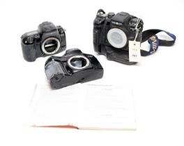 Three Minolta cameras