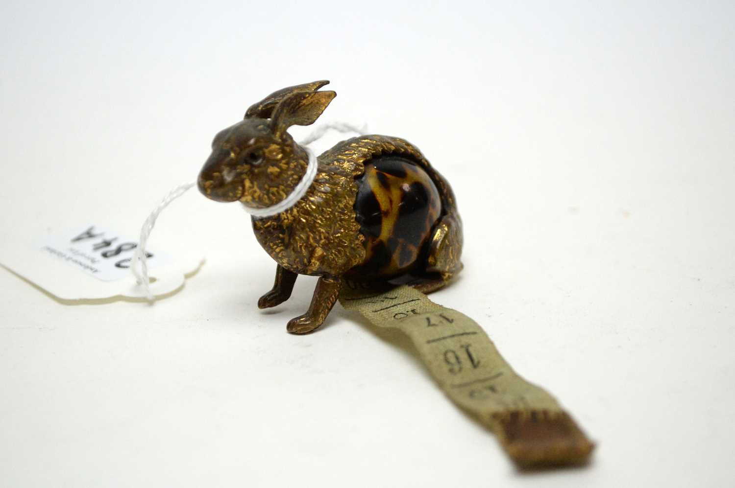 A late 19th century novelty tape measure