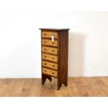 A pine and birds eye maple chest of drawers of small size