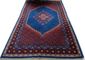 A vintage Islamic Oushak rug