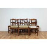 A set of seven Regency style mahogany dining chairs