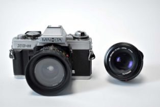 A Minolta XG-M camera and two lenses