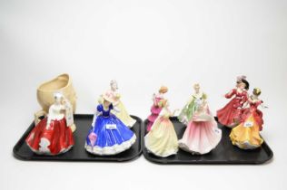 A collection of Royal Doulton figures and a Bretby musical jug