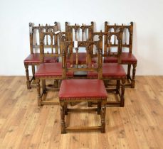 A set of six 20th Century Jacobean Revival oak dining chairs