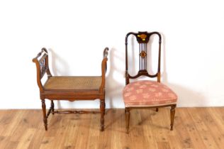 An Edwardian mahogany salon chair with twin handled rattan stool