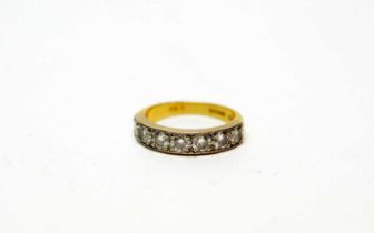 A diamond half-hoop eternity ring