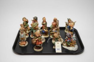 A collection of Hummel figures of children