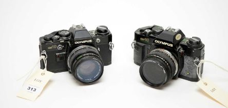 Two Olympus cameras