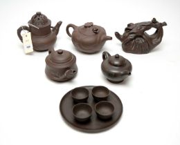 A collection of Chinese Yixing style tea pots and wares