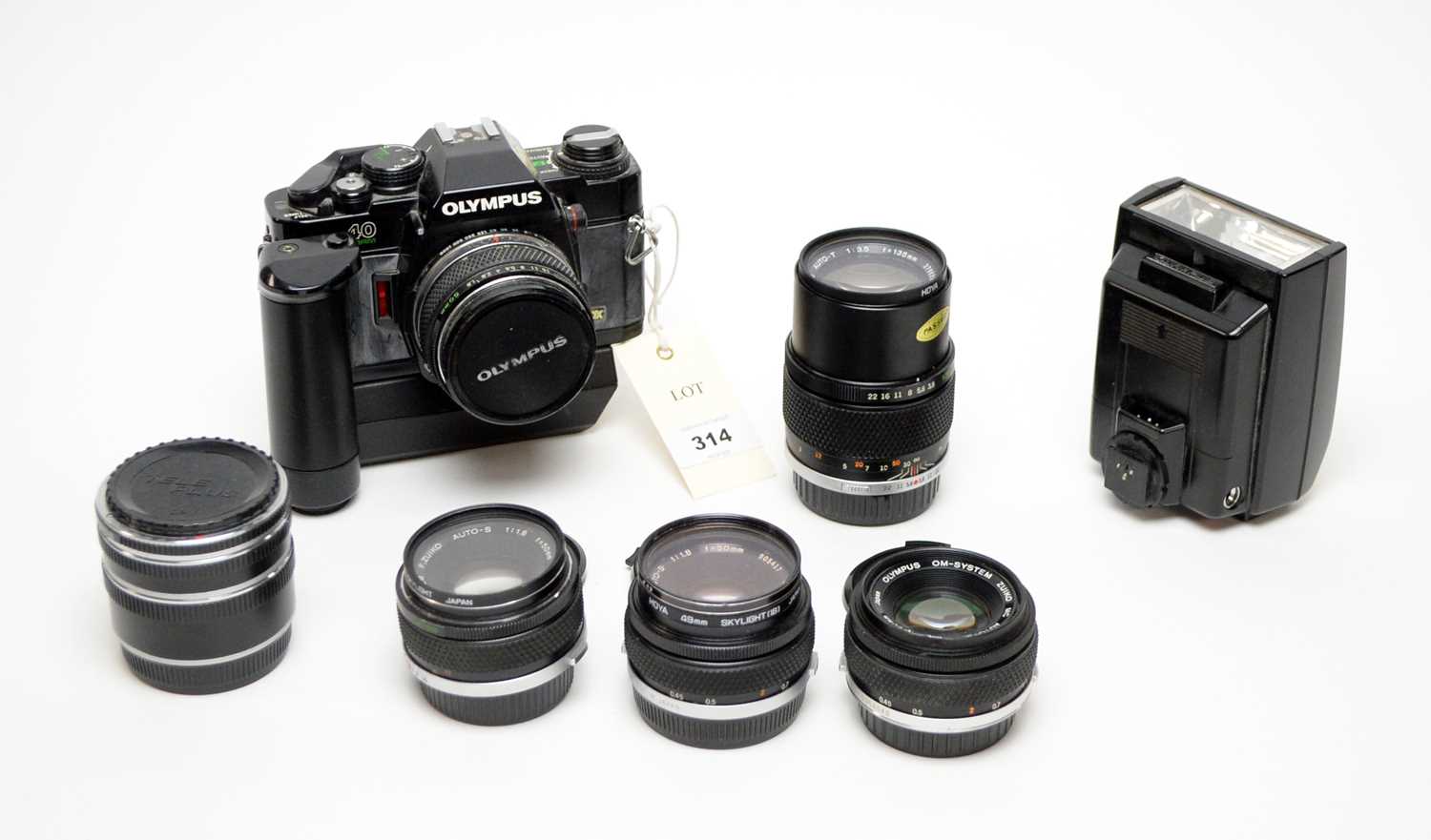 An Olympus OM40 Program camera; and a selection of lenses
