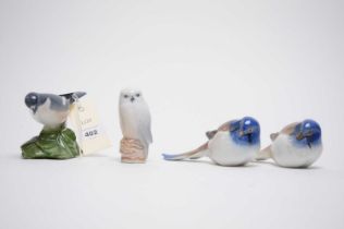 Three Royal Copenhagen ceramic bird figures; and a B&G bird