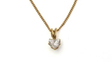 A heart-shaped diamond pendant on chain
