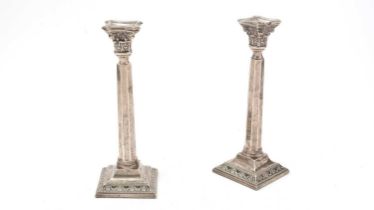 A pair of George VI silver candlesticks