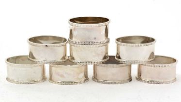 A set of eight Elizabeth II silver napkin rings