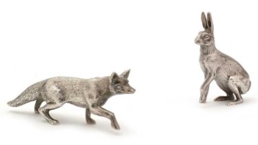 An Elizabeth II cast figure of a fox; and another figure of a hare