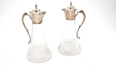 A pair of Elizabeth II silver-mounted cut-glass claret jugs