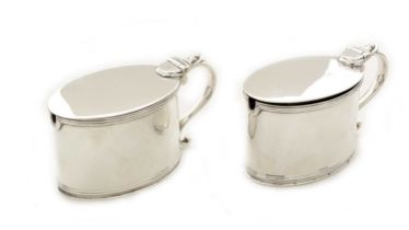 A matched pair of George III silver mustard pots