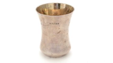 A contemporary silver beaker