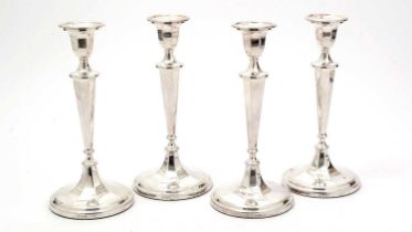 A set of four Elizabeth II silver candlesticks