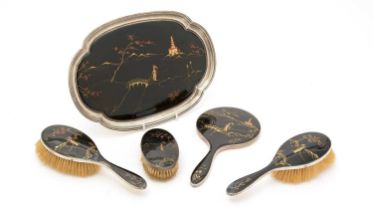 A George V silver mounted and enamel dressing table set