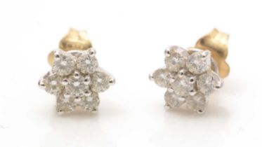 A pair of diamond cluster earrings