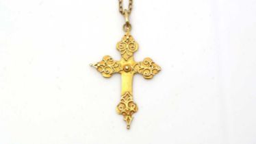 A gold crucifix pendant