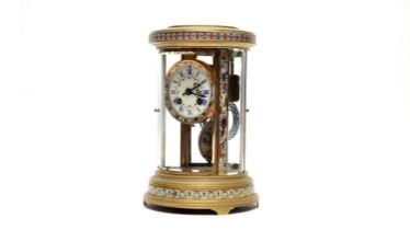 S Marti et Cie, Paris: a French champleve enamelled and gilt circular four glass mantel clock