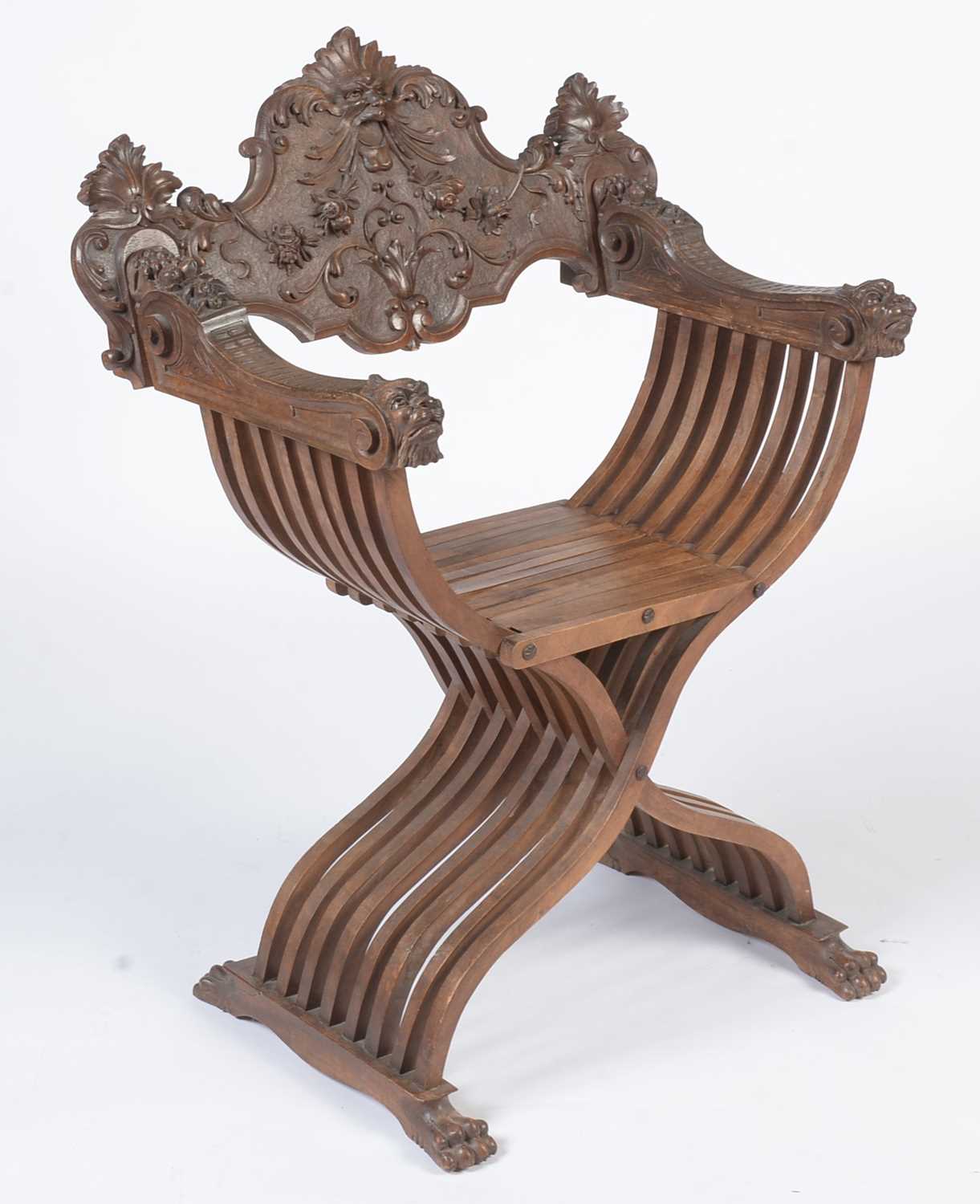 A decorative Italian carved walnut Savonarola chair c1900 - Image 9 of 21