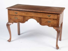 A walnut and herringbone banded dressing table in the Georgian taste