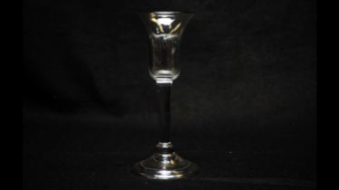 A bell-shaped wine glass