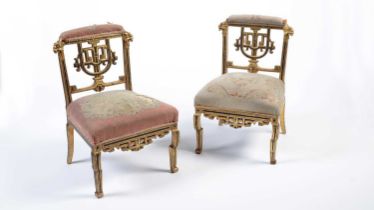 A pair of Napoleon III giltwood slipper chairs in the Chinese taste