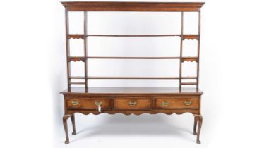 An 18th Century oak and mahogany banded dresser