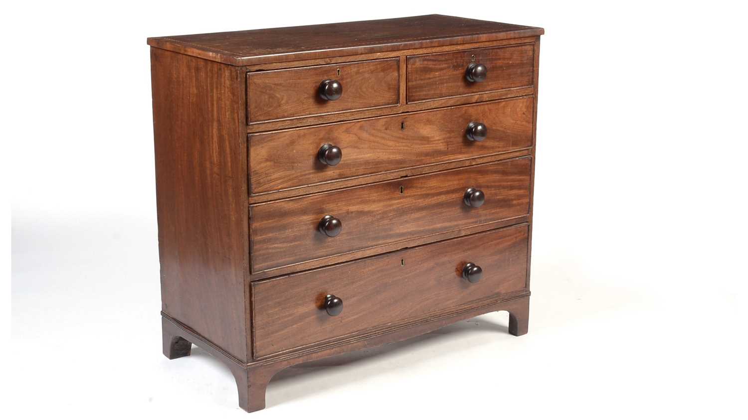 A Georgian inlaid mahogany chest of drawers