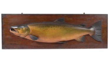 A large carved and painted half-block trophy model of a salmon