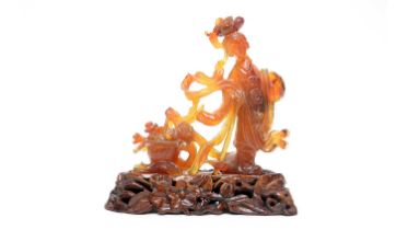 A Chinese carved agate figure of Quanyin