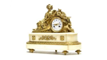 An ornate late 19th Century French gilt bronze and marble white mantle clock
