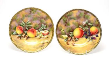 A pair of David Bowkett fruit-painted plates