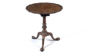 A George III style well-carved mahogany tilt-action table