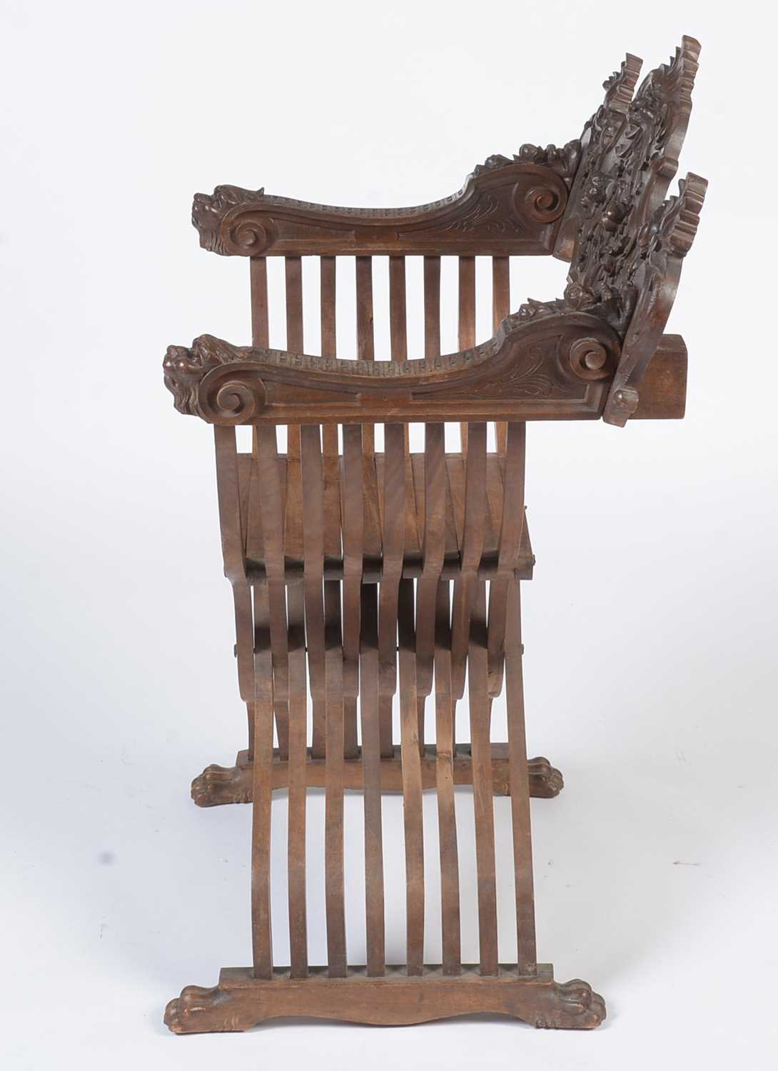 A decorative Italian carved walnut Savonarola chair c1900 - Image 5 of 21