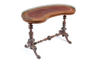 An attractive Victorian burr walnut kidney-shaped writing table