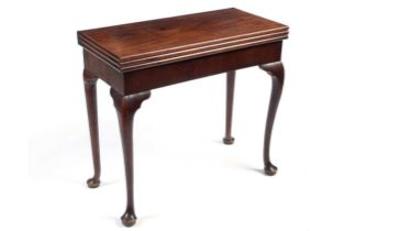 A George III mahogany triple fold-over tea and games table