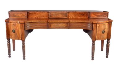A Scottish George III mahogany concave sideboard