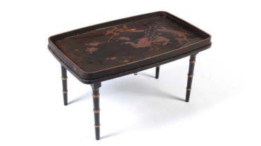 A decorative Japanese black lacquered tray on stand, early 20th Century