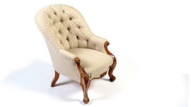 A Victorian carved walnut show frame and button-back easy chair