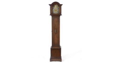 A mid 20th Century oak chiming grandmother clock