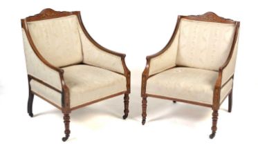 Two Edwardian inlaid rosewood easy chairs