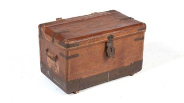 A vintage leather and metal bound travelling trunk.